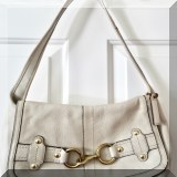 H13. Coach bone colored bag with brass buckle. 8”h - $48 